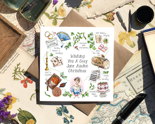 Image of a square greeting card with illustrations of a Regency Chritmas and 'Wishing You A Cosy Jane Austen Christmas' in the centre.